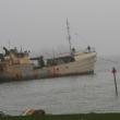 Lobsterman Bill Hallinan tows the Westward back out to its mooring off Signal Point after it had broken loose sometime Thursday morning. KEVIN BURNHAM/Boothbay Register
