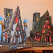 The many model houses Lee designs and builds as a hobby. The “Witches House” on the right is what Lee plans to build next. RYAN LEIGHTON/ Boothbay Register
