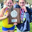 Two runners celebrate. 