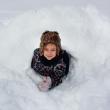 A Coastal Rivers camper shows off her quinzee, a type of snow shelter. Courtesy of Coastal Rivers