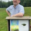 Matt Brough with one of the Story Walk Houses Mobius built and installed at Medomak Valley High School.