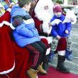 Jonah Curtz, right, shows Santa his drawing of a motorcycle as his brother, Theo, watches. FRITZ FREUDENBERGER/Boothbay Register