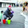 Reese Washburn, 3, tosses a ring to a reindeer with her father, David. FRITZ FREUDENBERGER/Boothbay Register