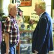 Sen. Angus King talks with George McEvoy, founder of the Boothbbay Railway Village Museum, during a celebration gathering for the Museum's 60th anniversary. File photo