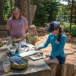 Children work with watercolor paints during a summer camp. Courtesy of CMBG