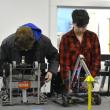 Thomas Babineau, left, and Anthony Angelico make adjustments. ISABELLE CURTIS/Boothbay Register
