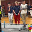 Brandon Seigars, Lucian Stoddard, and Anthony Angelico think about their strategy before one of their qualifying matches on Saturday in Monmouth. Courtesy of Kristen Hanley