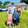 D.J. Holcomb and family during a change of command ceremony in Newport, Rhode Island. Courtesy of DJ Holcomb