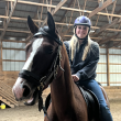 BRHS senior Harriet McKane rides atop Crash, the horse she helped break during her mentorship. Courtesy of Mary Miller