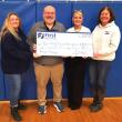 First National Bank presenting Boothbay Region High School with a check for $2,550 from the First Hoop program. Courtesy photo