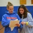 Maddie Orchard, left, and Abbie Clark figure out who won the "Huck-a-Hawk." KEVIN BURNHAM/Boothbay Register