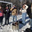 Lincoln Academy students enjoy the hot cocoa they prepared after building a fire. Courtesy of Shannon Parker