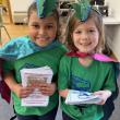 Penny Navarrete and Addie Adams hand out programs. Courtesy of Emily Mirabile