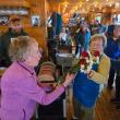 Dee Wright presents roses to Community Lunch volunteer Tancy Mitchell. Darrell Gudroe photo