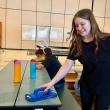 Isabel, daughter of Cashel and Brian Fanslau, makes the most of the opportunity to help clean the EES cafeteria after lunch. Courtesy photo