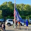 A father points out to his Pre-Ker how valuable the “big kids” are in the everyday functioning of Edgecomb Eddy School.  Raising the flag are Maxine, daughter of Pascale and Kirk Zehm;  Bryson, son of Melissa and Joseph Hersom;  Mason, son of Nicole McKay and Patrick Wenners;  and Sam, son of Daniel and Maureen Cooper.  Students are residents of Alna and Edgecomb. Courtesy photo