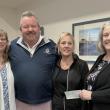 L- R: Angela Robinson, Director of Waiver Services, Mobius,  Mike and Sue Risinger, and Mobius Executive Director Michaela York, who accepted the donation on behalf of Mobius in memory of Kylee Risinger Turcotte. Courtesy of Eleanor Busby