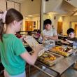 Fourth grader Joshua, son of Alma Stetson, and second grader Knowlyn, son of Nicole and Jason Blake, contribute their leftovers to the compost bins that sixth grade helper Lilianna, daughter of Trista and Brian Cassidy, will take out to the garden bins. Courtesy photo