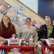 Volunteers keep things running smoothly at BRES' annual book fairs. From left, Katrina Densmore, Shannon Leeman and Cameron Holbrook. ISABELLE CURTIS/Boothbay Register