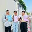 Thai Daughters Yuki, Prem, and Katang with their visas. Courtesy of Ellen James, FTD