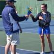 Seahawk coach Alex Arsenault presents flowers to senior Laura Chapman on senior day May 14. KEVIN BURNHAM/Boothbay Register