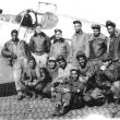 A group of Tuskegee airmen ground crew gather for a photo in front of the Gloria, a P-51 Mustang piloted by Flight Officer Thomas Lawson Hawkins. Courtesy of Bob Sheppard.