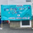 3rd graders hold welcome sign designed by Southport students. ISABELLE CURTIS/Boothbay Register