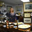 Laura de Haas of East Boothbay Trading Co., East Boothbay pauses for a "Kodak moment" during the June 6 First Friday.  LISA KRISTOFF/Boothbay Register
