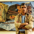 Joseph Fiore with his painting Virgo Tiger in 1987. The Maine Art Gallery and Maine Farmland Trust are collaborating on a retrospective of the artist’s six decades of work. Photo by Peggy McKenna, courtesy the Penobscot Marine Museum.