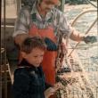Jerry out with his dad on the family's lobster boat. Courtesy of Jerry Farnham