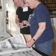 Attendees browse the Boothbay Register archives on display. STEVE EDWARDS/Boothbay Register