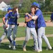 Liam Jacobs gets a hug from Aiden Locke after scoring the winning run in the last inning rally by the Seahawks against Buckfield Thursday, June 12. KEVIN BURNHAM/Boothbay Register