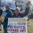 Alna's Sherry Lyons waves to motorists during a pro-federal funding for libraries rally April 10 at the bottom of Wiscasset Common. SUSAN JOHNS/Wiscasset Newspaper