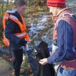 Maddie Andreasen, left, disposes of trash with the help of teacher Emily Higgins. FRITZ FREUDENBERGER/Boothbay Register 