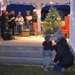 A mother and child share a moment while carolers sing before Santa's arrival Nov. 27 at the Boothbay Commons. FRITZ FREUDENBERGER/Boothbay Register