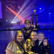  Evelyn Michaud, Lily Billings, Louie Mirabile and Oscar Mirabile pose for a photo with the team trophy while waiting for the theater to open. Emily Mirabile photo