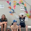 Three YMCA Dolphin swim team members at states. Courtesy of Emily LeGree 