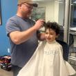 Pere del Rio getting his head shaved to get ready for the state swim meet. Courtesy of Emily LeGree 