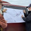 Harmon, right, updates Cohen on project plans. SUSAN JOHNS/Wiscasset Newspaper