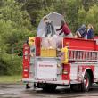 Teacher and graduates arrive at Newagen Inn via a fire truck. Eileen Higgins photo