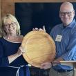 Holly Stover accepting a commemorative plaque from Keith Metrich, Chair, LCDC at awards ceremony. Courtesy photo