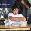 Alex Labbe (far right) wins Dunton Doghouse's third annual hot dog eating contest during Windjammer Days. ISABELLE CURTIS/Boothbay Register