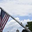 This man climbs down carefully after unfurling the flag,  Chris and Dave Gagne. LISA KRISTOFF/Boothbay Register