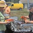Boothbay Harbor fireman Arthur Richardson serves up a lobster during the Aug. 1 Lobster Bake. BILL PEARSON/Boothbay Register
