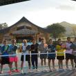 Wide-shot pickleball players at the net in front of Sala. Courtesy of FTD