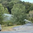Water is dispersed onto the propane tanks and area behind the Meadow Mall. Mark Sullivan photo
