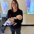 Jennifer Harris, of First Point Training, holds a training infant used in the American Red Cross Babysitter Training. Courtesy of Raye Leonard
