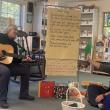 At CTL's Song and Story, Annie Nixon plays guitar while Katy Inman pairs the music with books that engage young learners and their caregivers. Courtesy of CTL