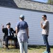 The knowledgeable and entertaining Howard Wright with Burnt Island visitors. LISA KRISTOFF/Boothbay Register