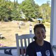 A father and son play volleyball on the lawn just over Danielle's shoulder. LISA KRISTOFF/Boothbay Register